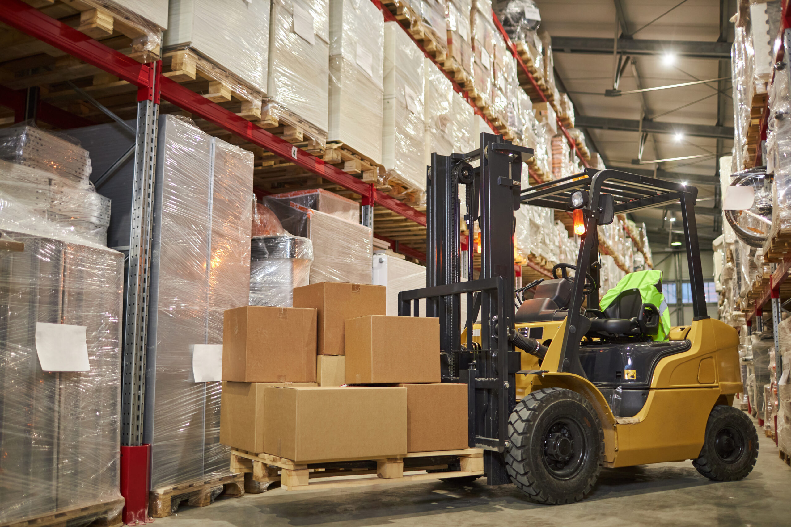 Background image of forklift truck in warehouse interior with tall shelves, copy space